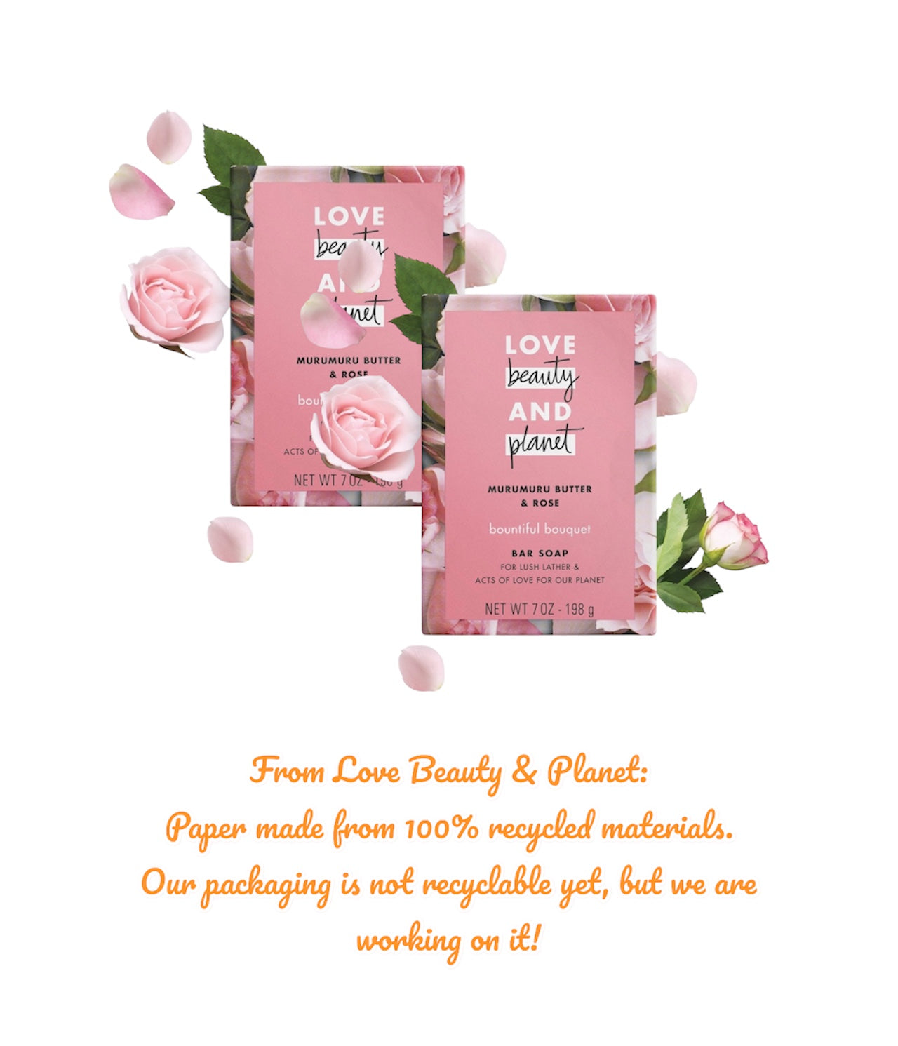 Two pink bar soaps with floral design on packaging, surrounded by roses and green leaves, on a white background.