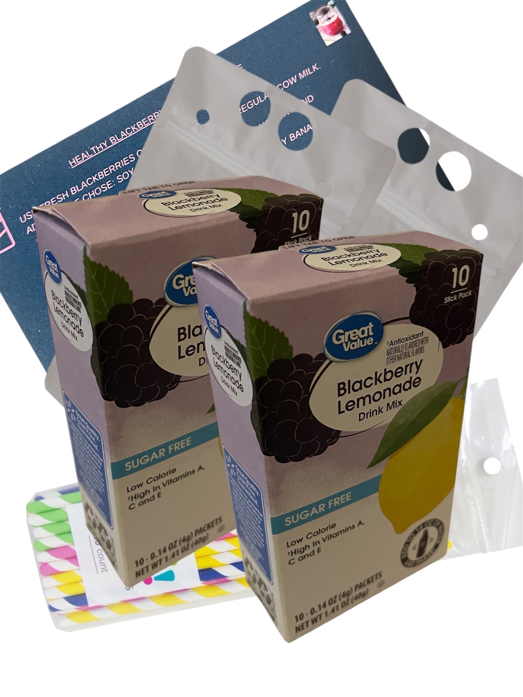 Packaging of blackberry lemonade 2 boxes with a white background with drink pouches and package of straws and recipe card